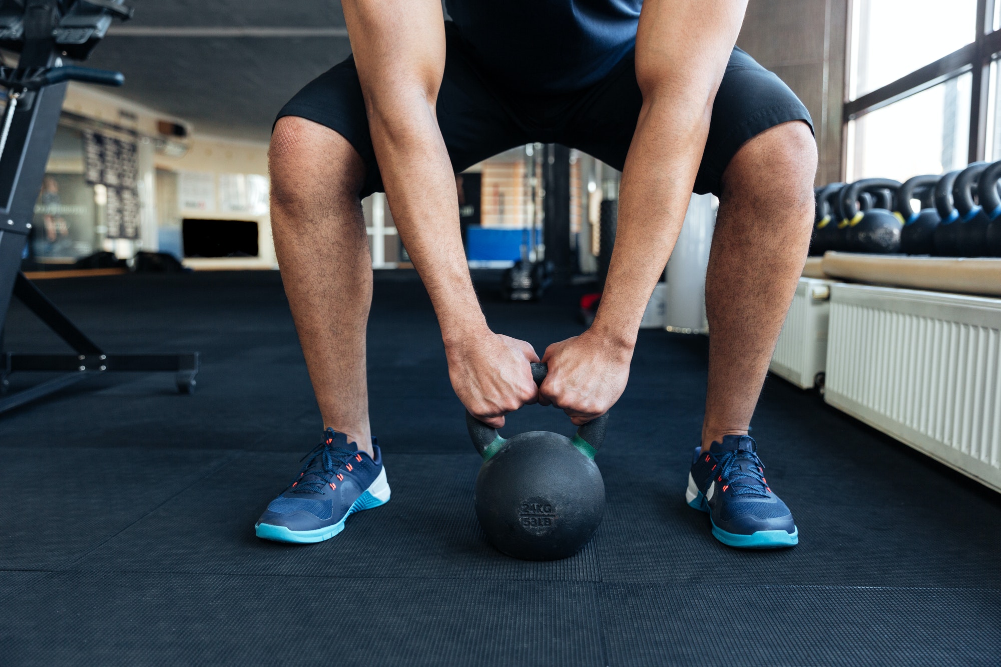 Bodybuilder working out with kettlebell